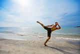 guy kick boxing by the beach