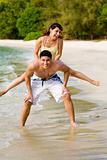 couples having fun by the beach
