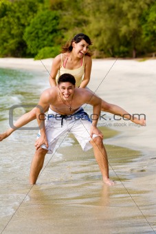 couples having fun by the beach