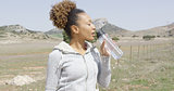 Female drinking water during workout