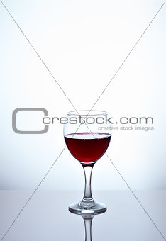 glass filled with half red wine
