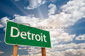 Detroit Green Road Sign Over Clouds