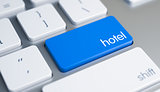 Hotel - Inscription on Blue Keyboard Button. 3D.