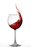 Glass with a splash of red wine isolated on white background