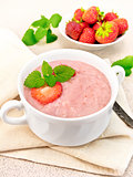 Soup strawberry in white bowl on napkin