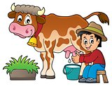 Farmer milking cow image 1