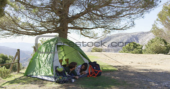 Romantic couple taking rest in tent