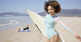 Female posing with surfboard