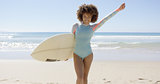 Female holding surfboard on sea background