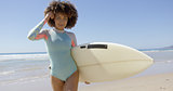 Female with surfboard posing on sea background
