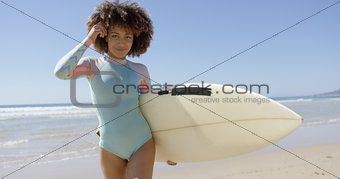 Female with surfboard posing on sea background
