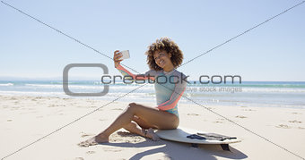 Female taking selfie on beach