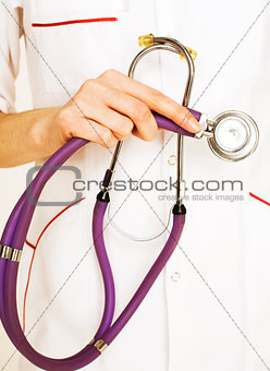 Close-up of female doctor holding stethoscope