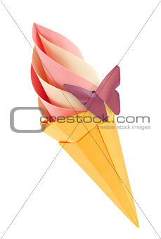 Fruit pink and vanilla ice-cream in waffle cone with purple butterfly.