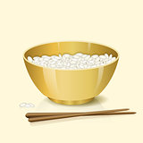 yellow bowl with rice and chopsticks