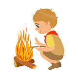 Boy scout squatting near the bonfire, a colorful character