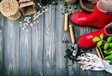 Gardening tools with soil red boots