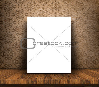 3D blank canvas on wooden table against grunge wallpaper backgro