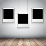 Collection of hanging blank photos 