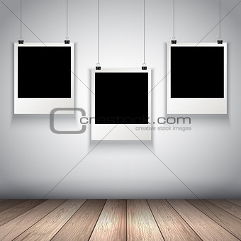 Collection of hanging blank photos 