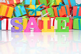 Sale written by colorful letters on the background of gifts