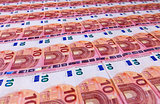 Small ten euro bills layer in low angle perspective