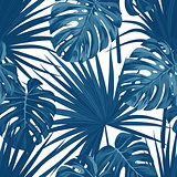 Blue denim floral pattern with exotic plants and palm leaves. Seamless vector fabric design.