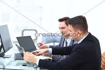 Two colleagues businessman discussing data and digital tablet and computer laptop with smart phone with digital business strateg