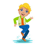 Boy Dancing Splashing Water, Kid In Autumn Clothes In Fall Season Enjoyingn Rain And Rainy Weather, Splashes And Puddles