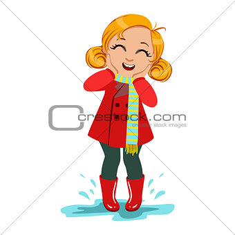 Girl In Red Coat And Rubber Boots, Kid In Autumn Clothes In Fall Season Enjoyingn Rain And Rainy Weather, Splashes And Puddles