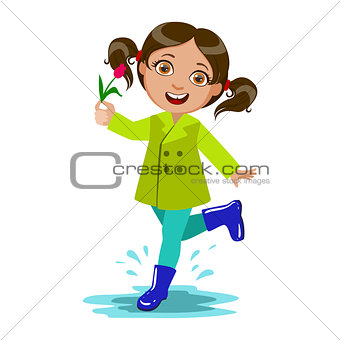 Girl With The Flower, Kid In Autumn Clothes In Fall Season Enjoyingn Rain And Rainy Weather, Splashes And Puddles