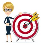 Business woman holding target with arrow.