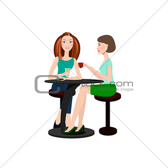 Two beautiful women sitting in a cafe