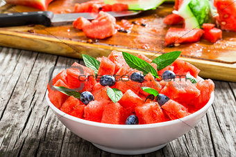 watermelon with blueberries and fresh mint , selective focus