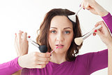 Portrait of a girl with brushes for makeup