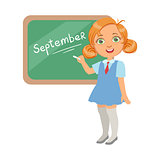 Llittle girl standing near the blackboard and writing word September, a colorful character isolated on a white background