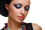 Beautiful girl with bright vivid purple and green make-up
