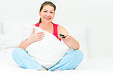 woman hugging a pillow and watch TV