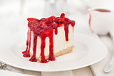 Delicious cheesecake decorated with berry sauce