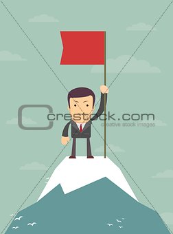 young man standing on top of mountain with flag