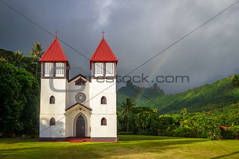 Rainbow on Haapiti church in Moorea island, landscape