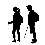 Silhouettes of two hikers with backpacks 