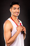 fitness east asian man on dark grey background