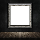3D grunge picture frame with a wooden table against a grunge met