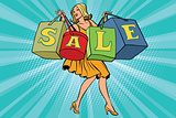 Blond woman with shopping bags sale