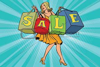 Blond woman with shopping bags sale