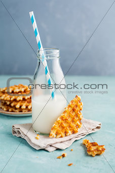 Tasty crispy waffles with milk