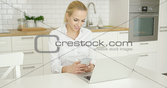 Beautiful girl with phone and laptop