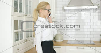 Smiling businesswoman talking by phone