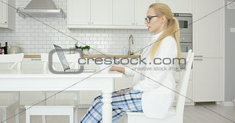 Young successful woman using laptop